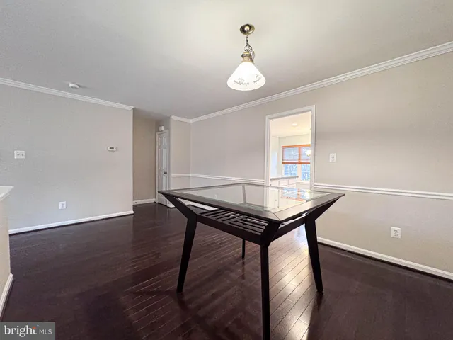 a view of an empty room with a ceiling fan
