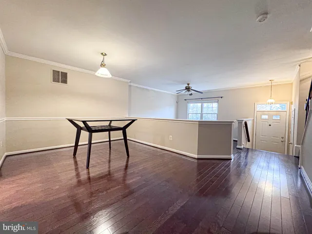 a front view of a house with a fence