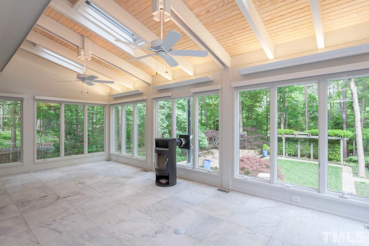 8016 Selfridge Court Raleigh, NC 27615 - Photo 11 of 25 a view of an empty room with windows and pool