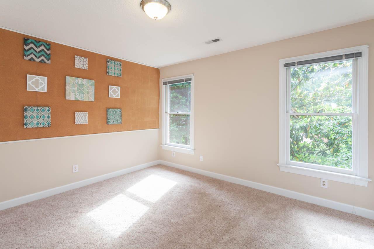 8016 Selfridge Court Raleigh, NC 27615 - Photo 17 of 25 a view of an empty room with a window