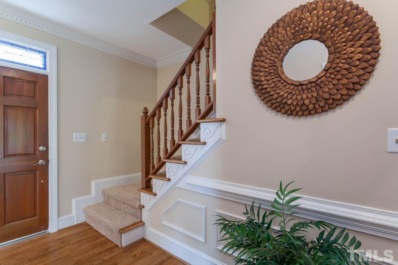 8016 Selfridge Court Raleigh, NC 27615 - Photo 3 of 25 a view of entryway with wooden floor and a rug