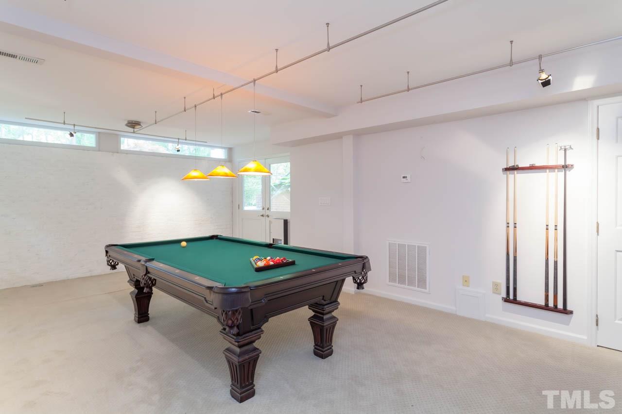 8016 Selfridge Court Raleigh, NC 27615 - Photo 21 of 25 a room with pool table and windows