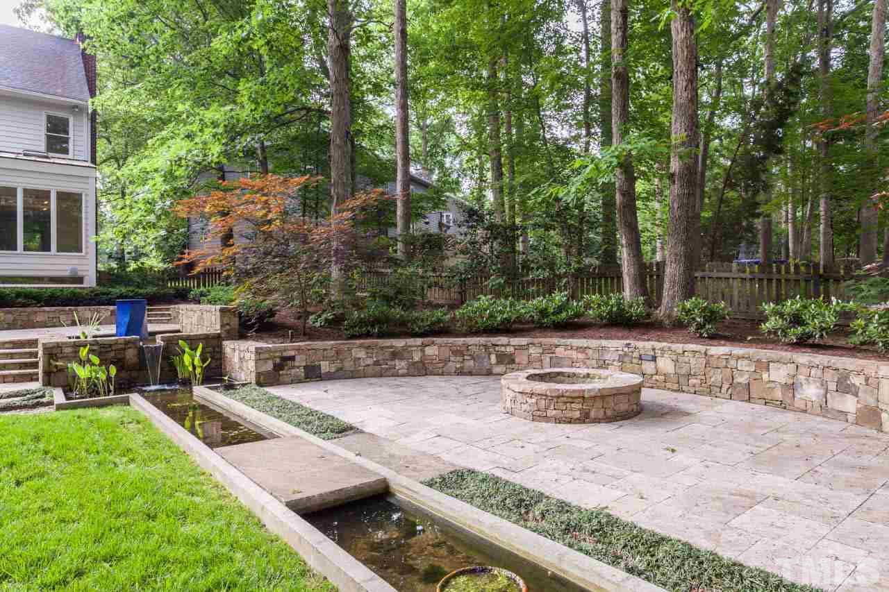 8016 Selfridge Court Raleigh, NC 27615 - Photo 22 of 25 a view of a backyard with a patio