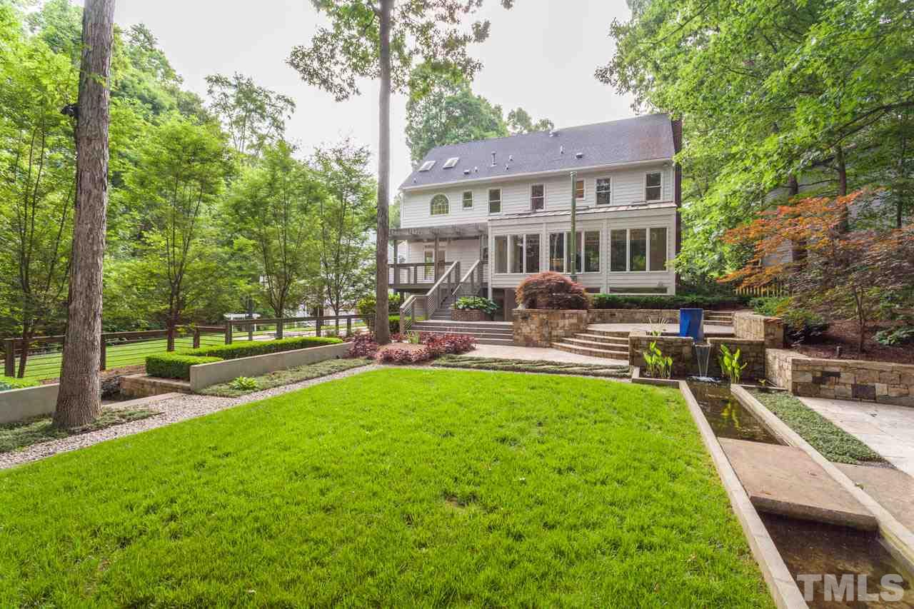 8016 Selfridge Court Raleigh, NC 27615 - Photo 23 of 25 a view of a patio with a table and chairs