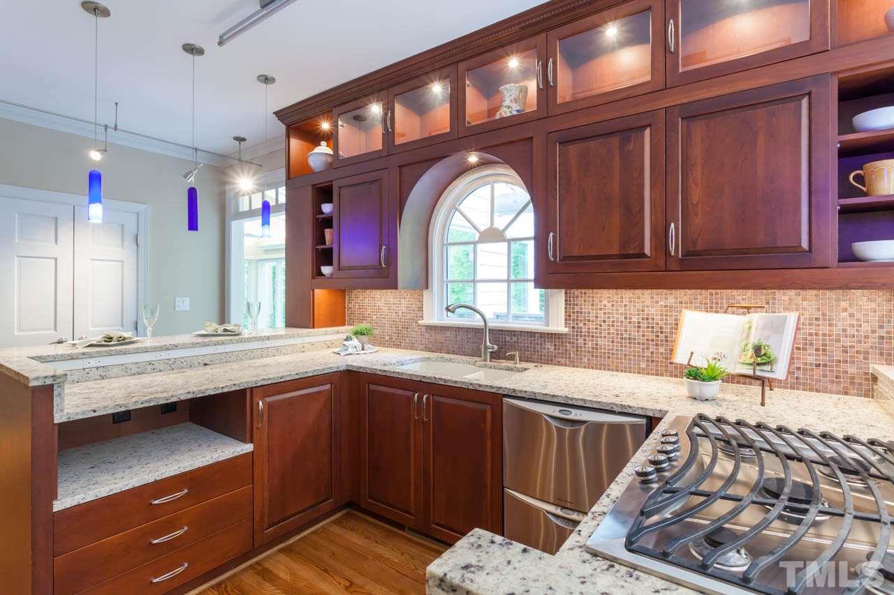 8016 Selfridge Court Raleigh, NC 27615 - Photo 4 of 25 a kitchen with a sink and cabinets