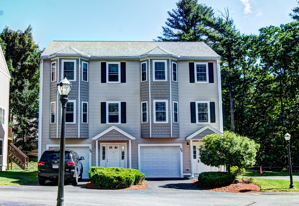 262 Littleton Road, Unit 22 Chelmsford, MA 01824 - Photo 1 of 30 a front view of a house with garden