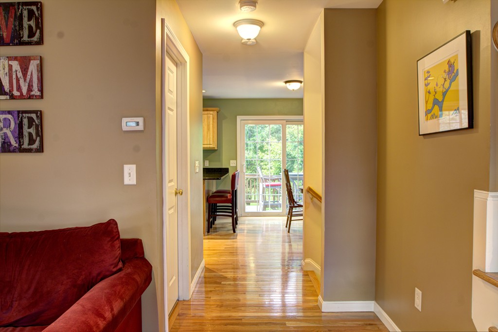 262 Littleton Road, Unit 22 Chelmsford, MA 01824 - Photo 12 of 30 a living room with furniture and a floor to ceiling window