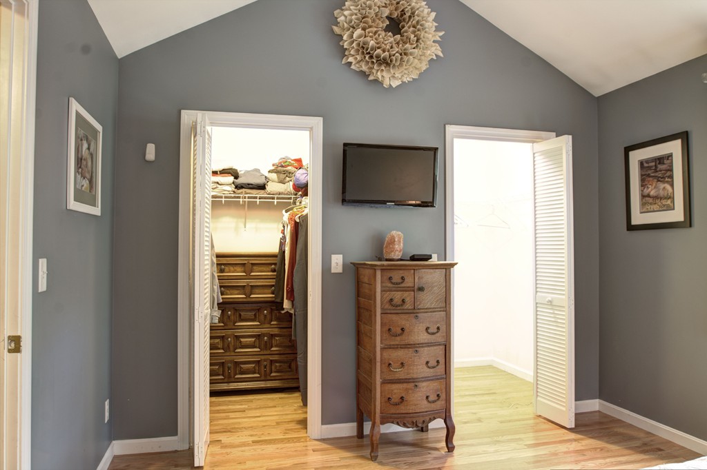 262 Littleton Road, Unit 22 Chelmsford, MA 01824 - Photo 19 of 30 a view of walk in closet with furniture and wooden floor