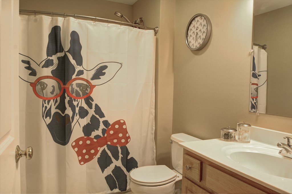 262 Littleton Road, Unit 22 Chelmsford, MA 01824 - Photo 21 of 30 a bathroom with a toilet sink and mirror