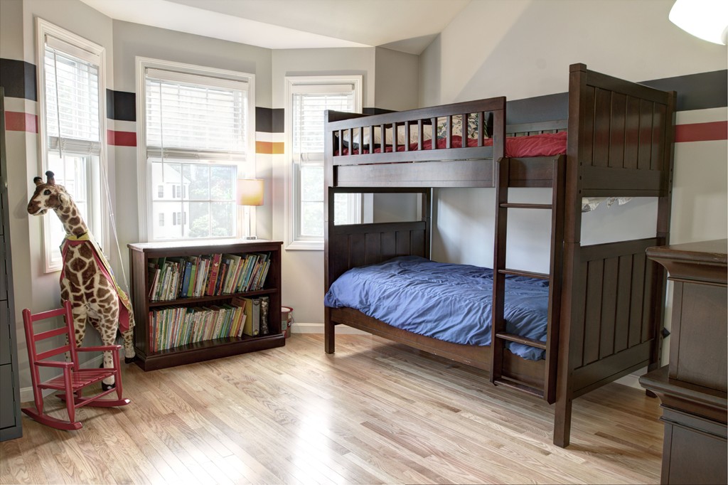 262 Littleton Road, Unit 22 Chelmsford, MA 01824 - Photo 23 of 30 a bedroom with a bed and wooden floor