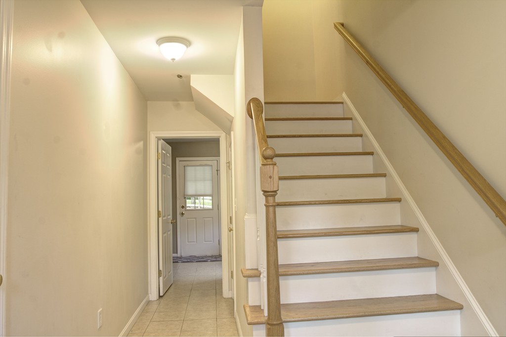 262 Littleton Road, Unit 22 Chelmsford, MA 01824 - Photo 27 of 30 a view of a hallway with wooden floor and entryway