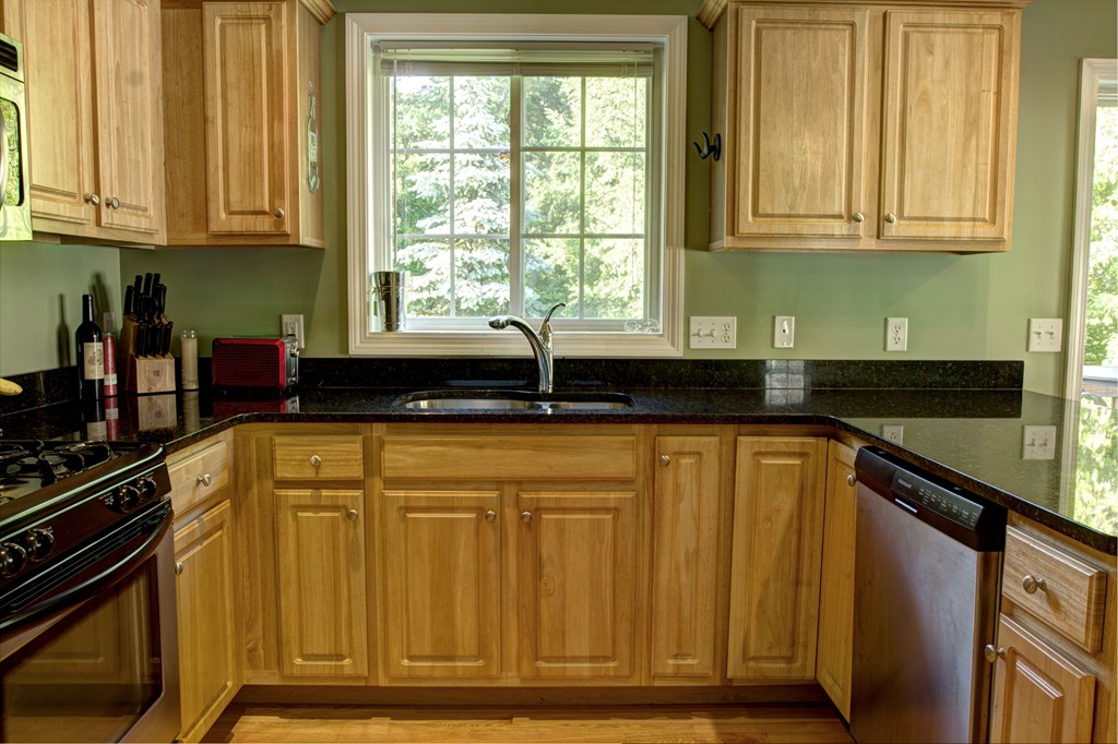 262 Littleton Road, Unit 22 Chelmsford, MA 01824 - Photo 7 of 30 a kitchen with granite countertop a sink and cabinets