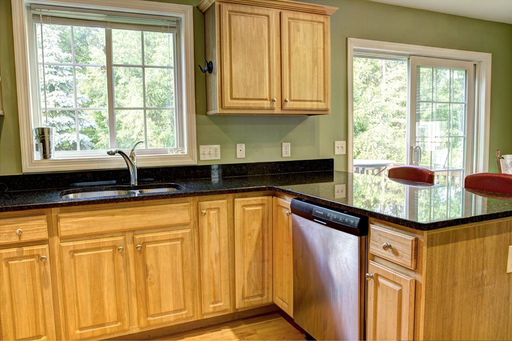 262 Littleton Road, Unit 22 Chelmsford, MA 01824 - Photo 8 of 30 a kitchen with granite countertop cabinets and window