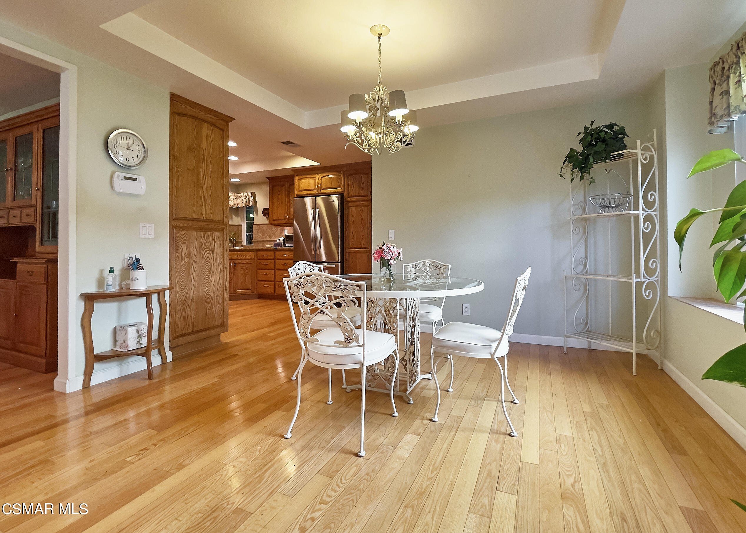 4110 Oakcliff Drive Moorpark, CA 93021 - Photo 24 of 67 a dining room with furniture a chandelier and wooden floor