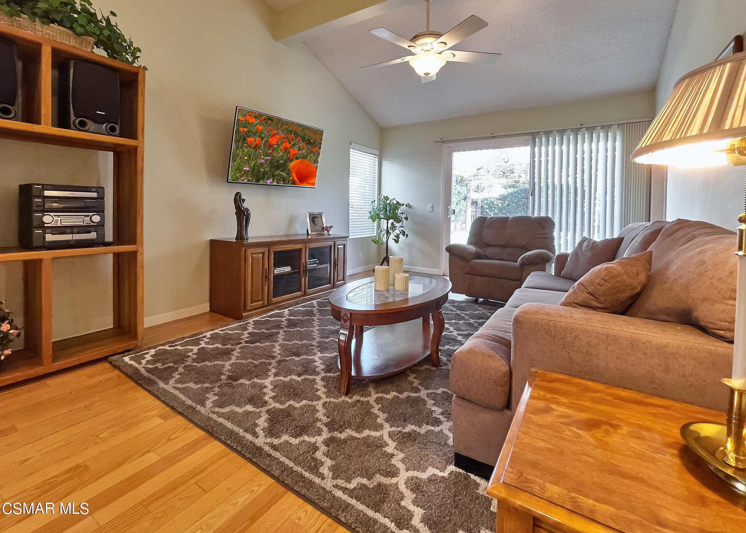4110 Oakcliff Drive Moorpark, CA 93021 - Photo 30 of 67 a living room with furniture a flat screen tv and a table