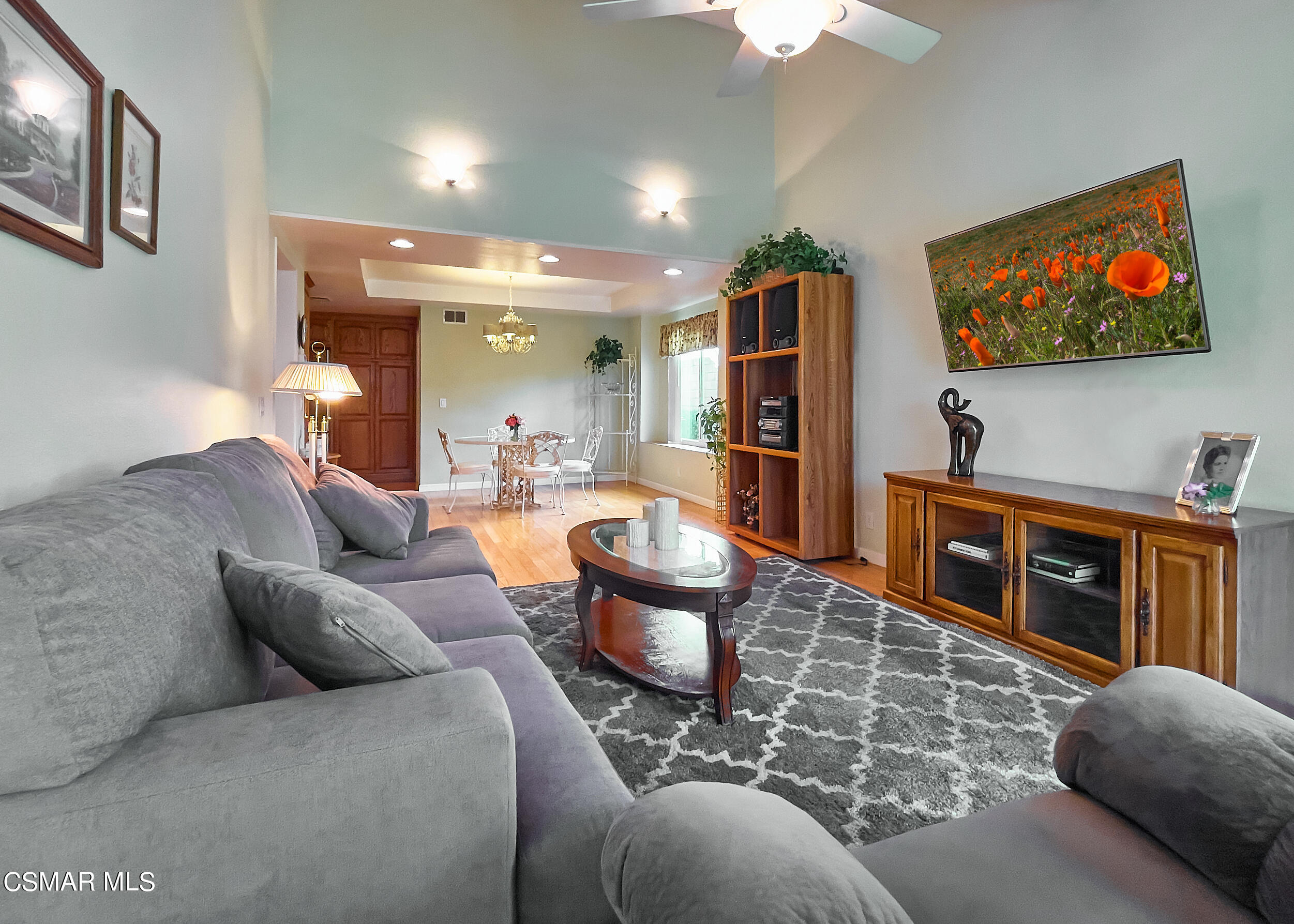 4110 Oakcliff Drive Moorpark, CA 93021 - Photo 34 of 67 a living room with furniture a flat screen tv and a refrigerator
