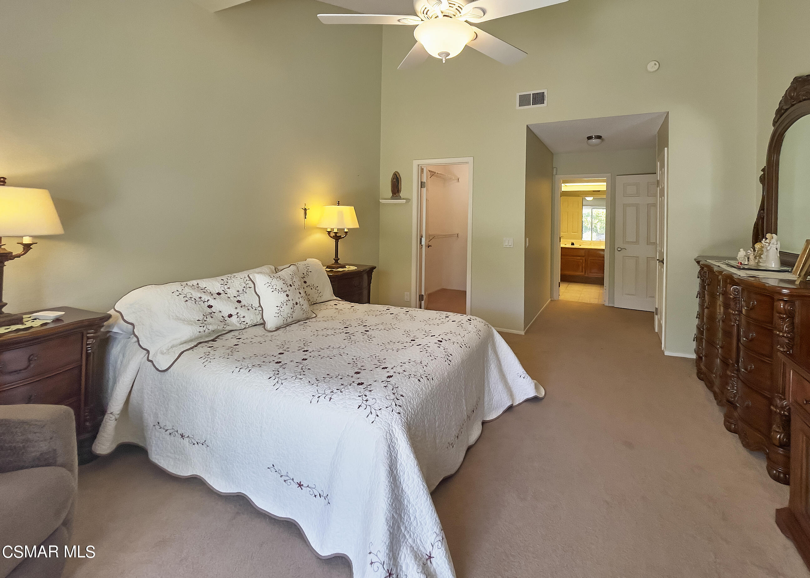 4110 Oakcliff Drive Moorpark, CA 93021 - Photo 46 of 67 a bedroom with a bed and a chandelier