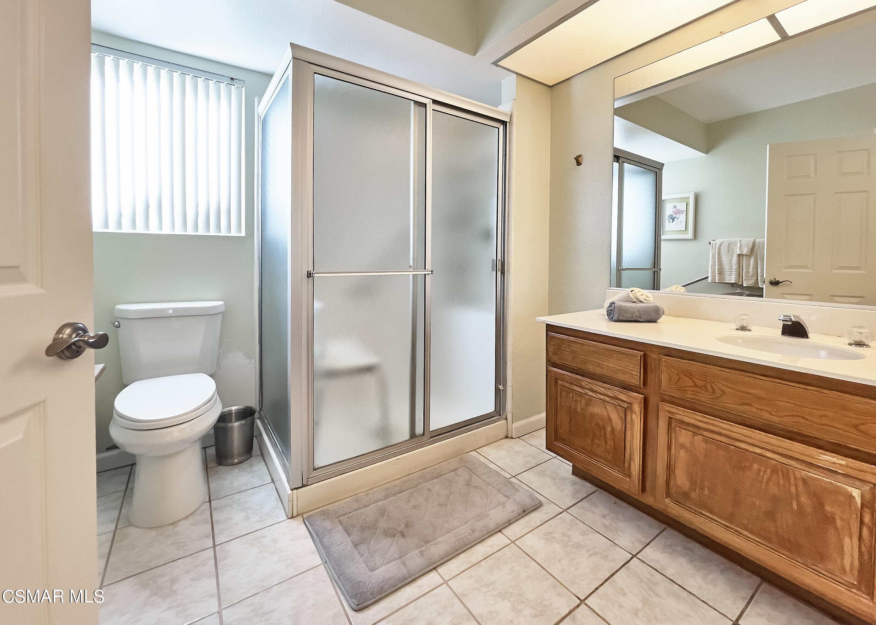 4110 Oakcliff Drive Moorpark, CA 93021 - Photo 48 of 67 a spacious bathroom with a toilet sink and a mirror