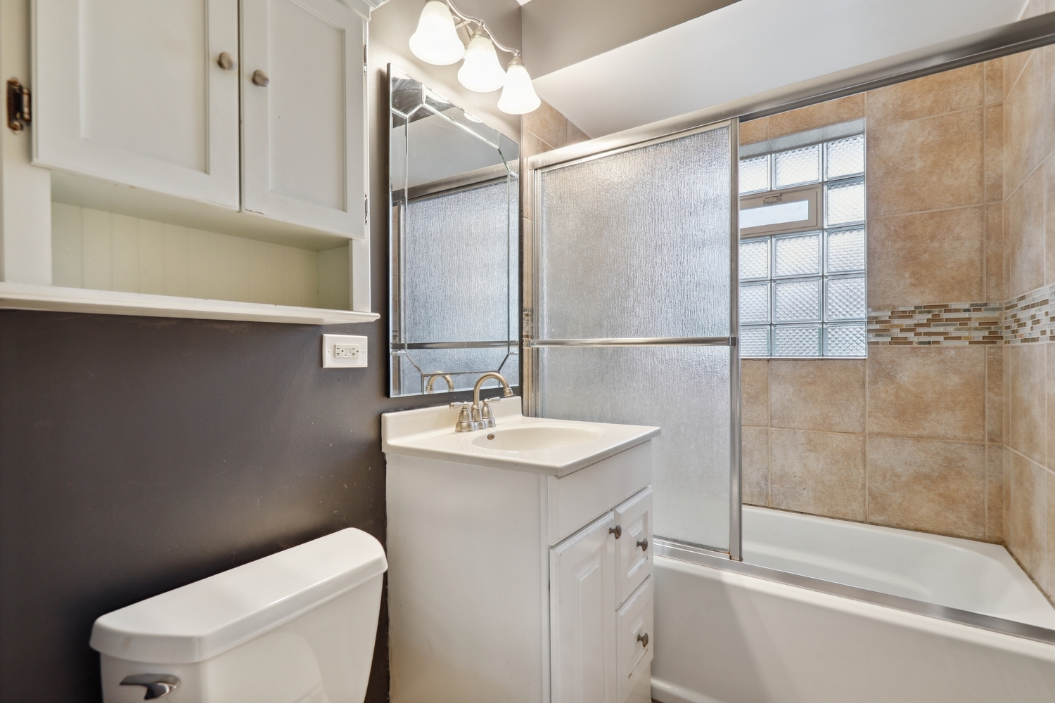 5932 107th Place Chicago Ridge, IL 60415 - Photo 13 of 22 a bathroom with a sink toilet vanity and shower