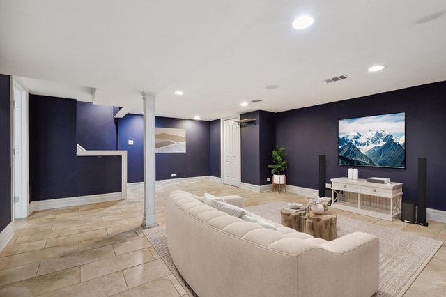 5932 107th Place Chicago Ridge, IL 60415 - Photo 14 of 22 a living room with furniture and a flat screen tv