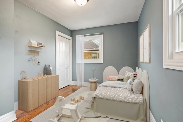 5932 107th Place Chicago Ridge, IL 60415 - Photo 9 of 22 a bedroom with a bed and wooden floor