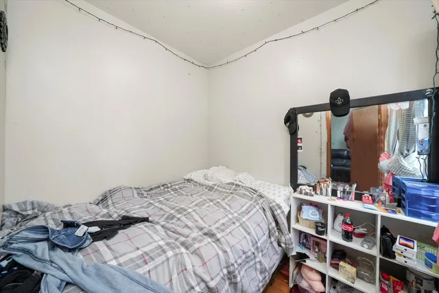 a bedroom with a bed and a table in it