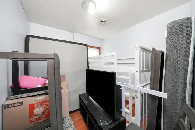 a view of room with window and refrigerator