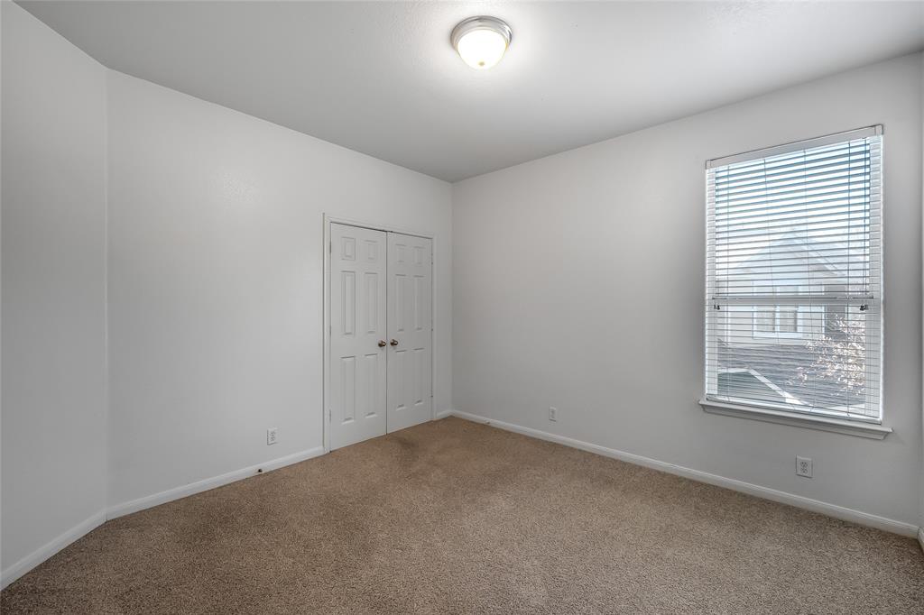 2518 Allred Drive, Unit A Austin, TX 78748 - Photo 12 of 16 Empty room featuring baseboards and carpet flooring