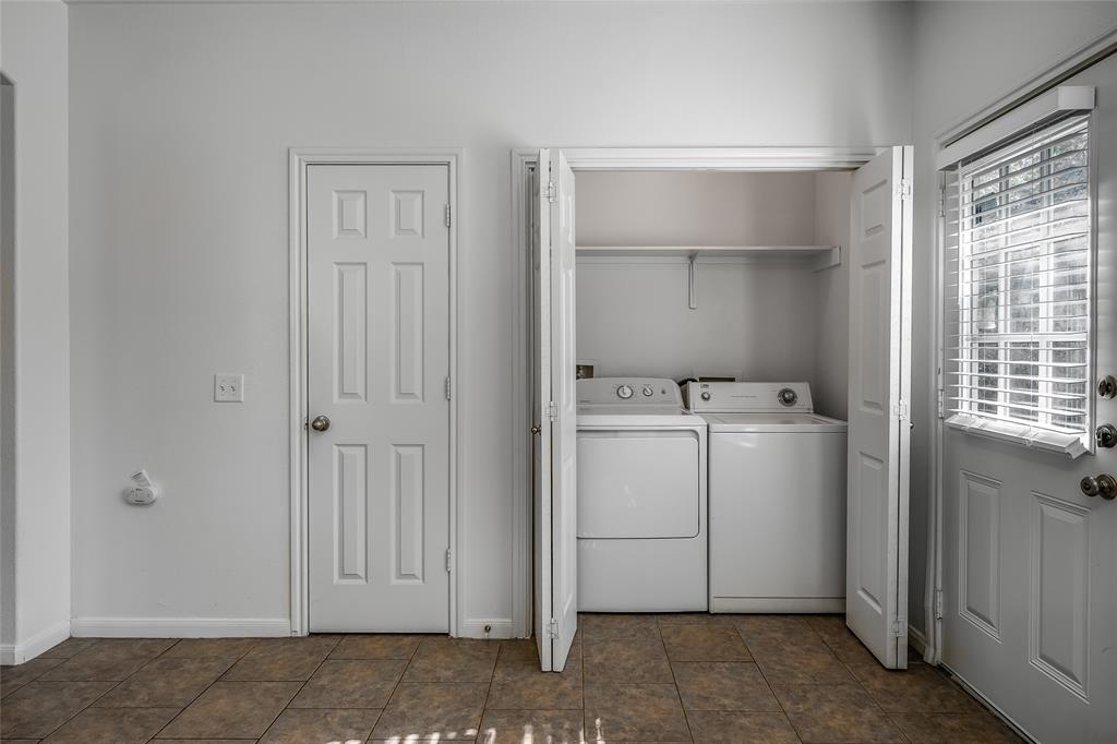 2518 Allred Drive, Unit A Austin, TX 78748 - Photo 14 of 16 Laundry area featuring baseboards and washing machine and clothes dryer