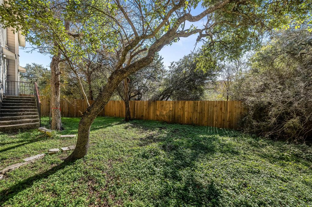 2518 Allred Drive, Unit A Austin, TX 78748 - Photo 16 of 16 Fenced backyard featuring stairs