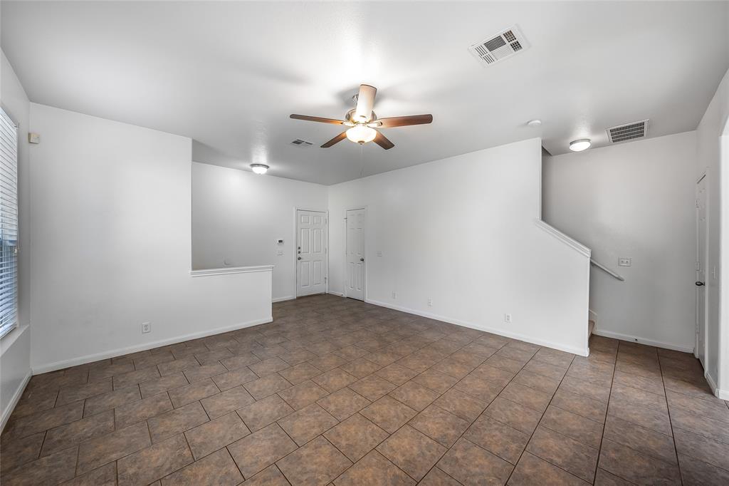 2518 Allred Drive, Unit A Austin, TX 78748 - Photo 5 of 16 Spare room featuring ceiling fan and baseboards