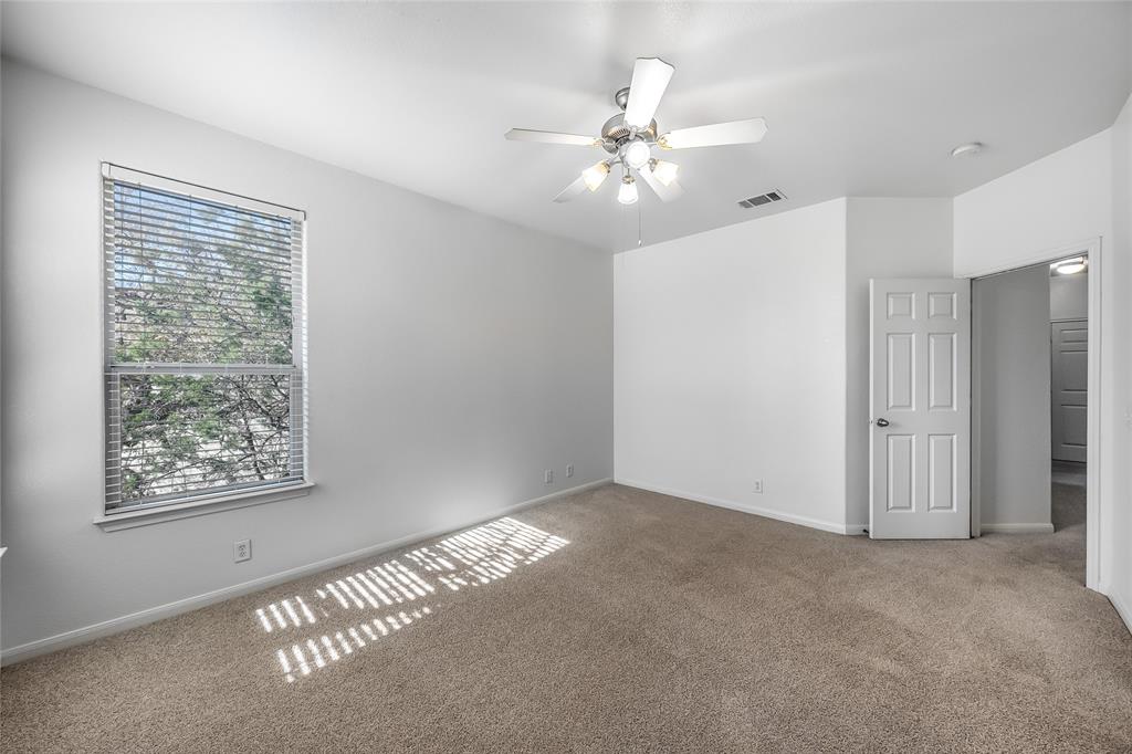 2518 Allred Drive, Unit A Austin, TX 78748 - Photo 6 of 16 Carpeted empty room with ceiling fan and baseboards
