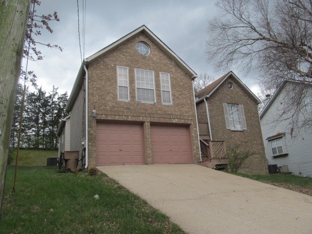4740 Billingsgate Road Antioch, TN 37013 - Photo 1 of 5 a front view of a house with a yard and garage