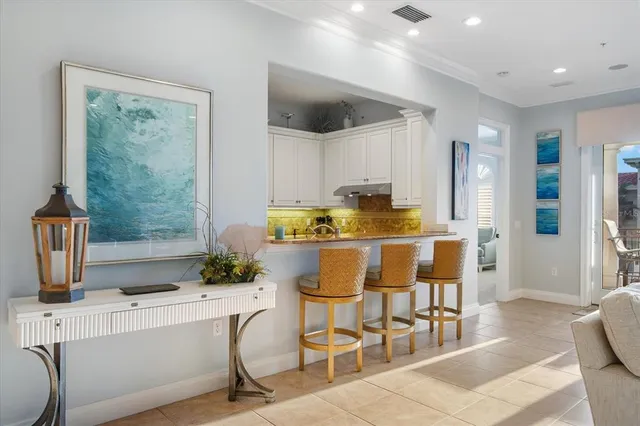 a living room with furniture a large window and a flat screen tv