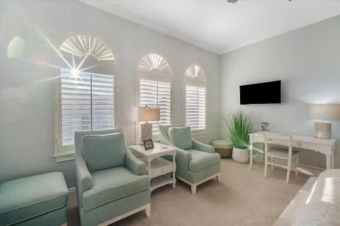 a bathroom with a sink a toilet and a large mirror