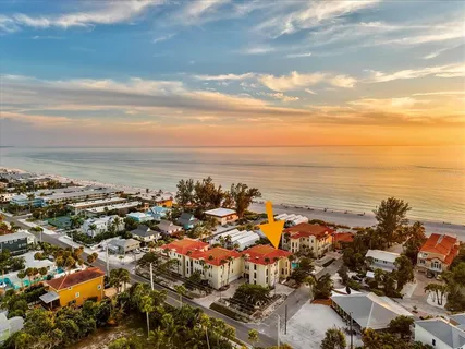 a view of a a dining room with furniture window and wooden floor