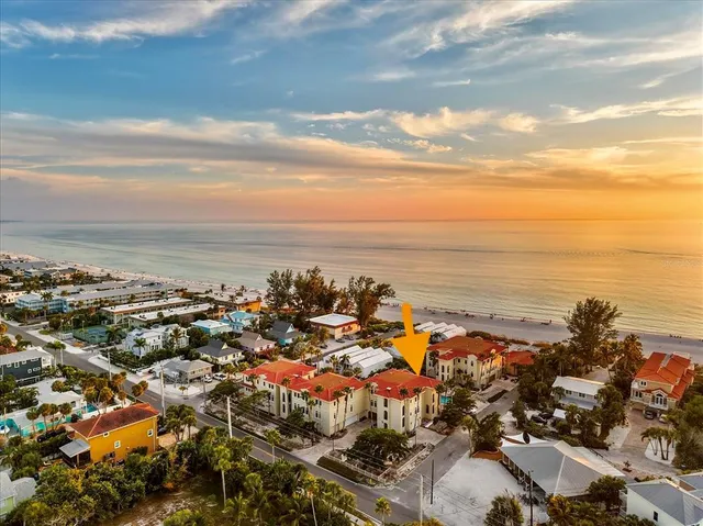 a view of a a dining room with furniture window and wooden floor