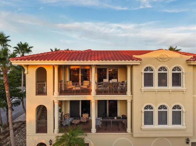 a living room with furniture kitchen view and a rug