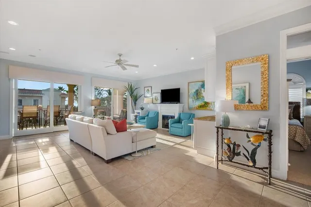 a kitchen with granite countertop white cabinets and stainless steel appliances