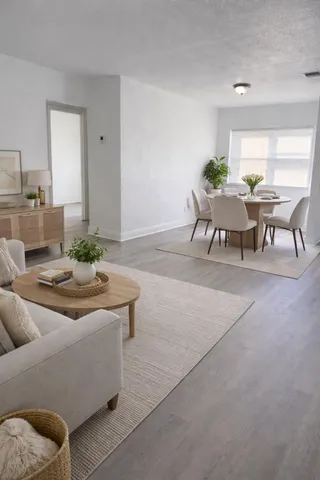 a living room with furniture and a table