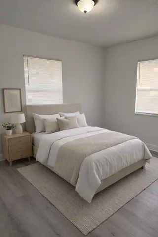 a bedroom with a bed and window