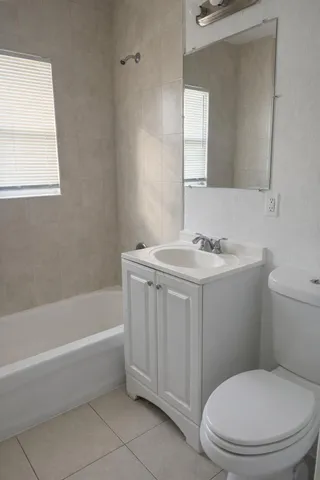 a bathroom with a sink a toilet and bathtub