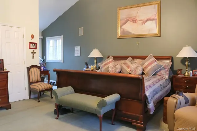 a living room with furniture and a lamp