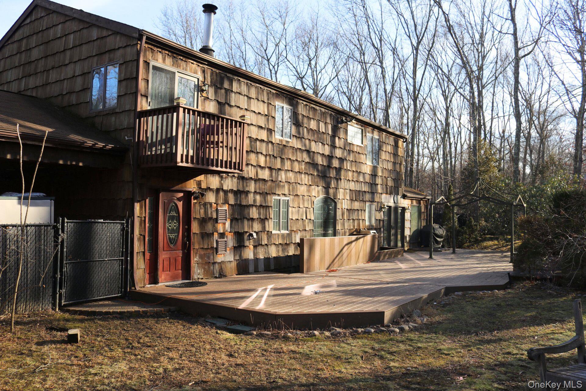 35 Hastings Drive Ridge, NY 11961 - Photo 34 of 39 Rear view of house with a deck