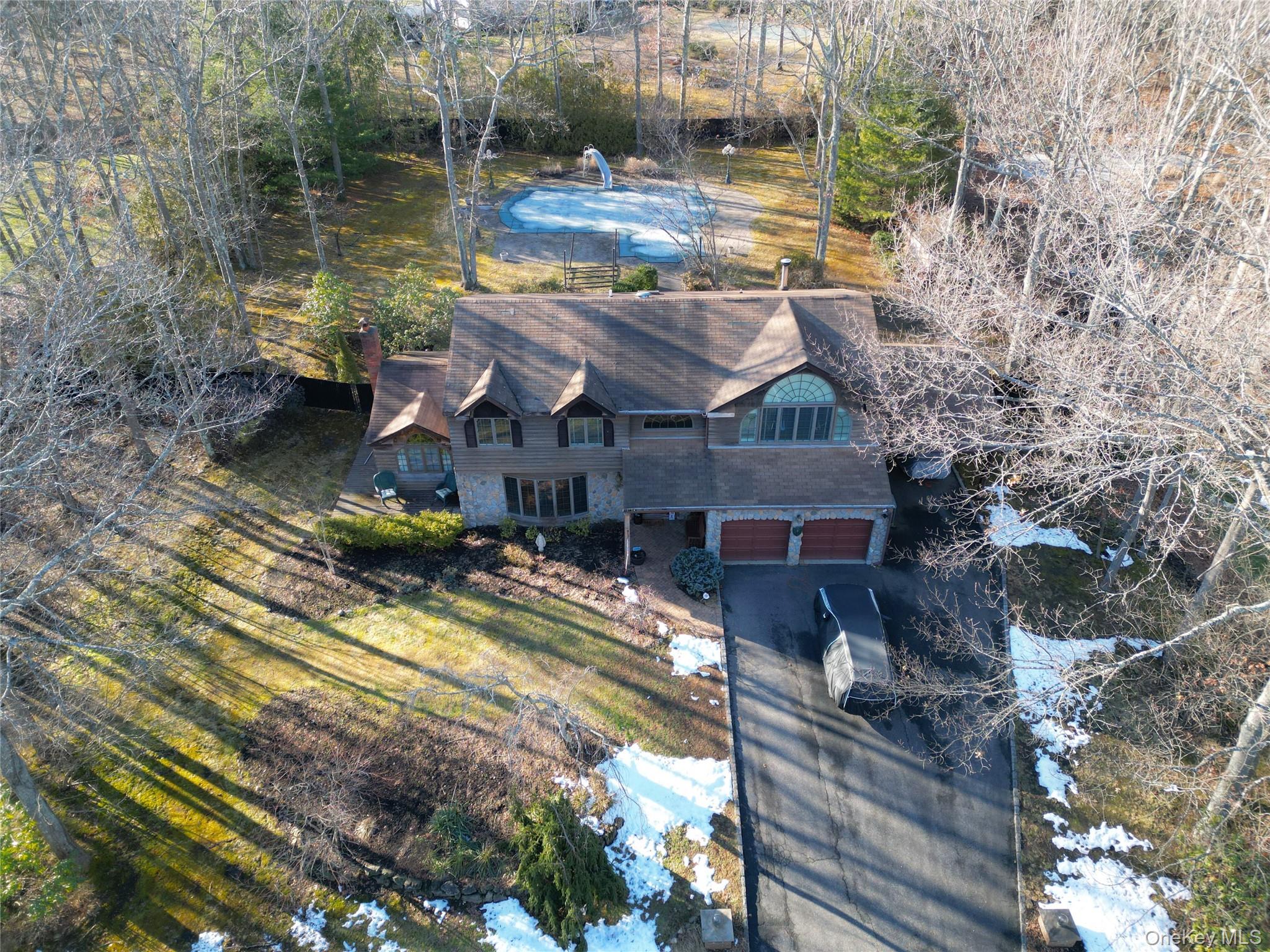 35 Hastings Drive Ridge, NY 11961 - Photo 4 of 39 Aerial view of property and surrounding area with a tree filled landscape