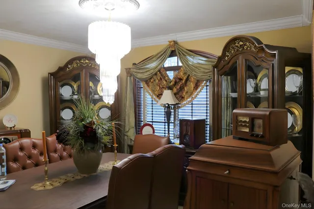 a living room with furniture and a mirror