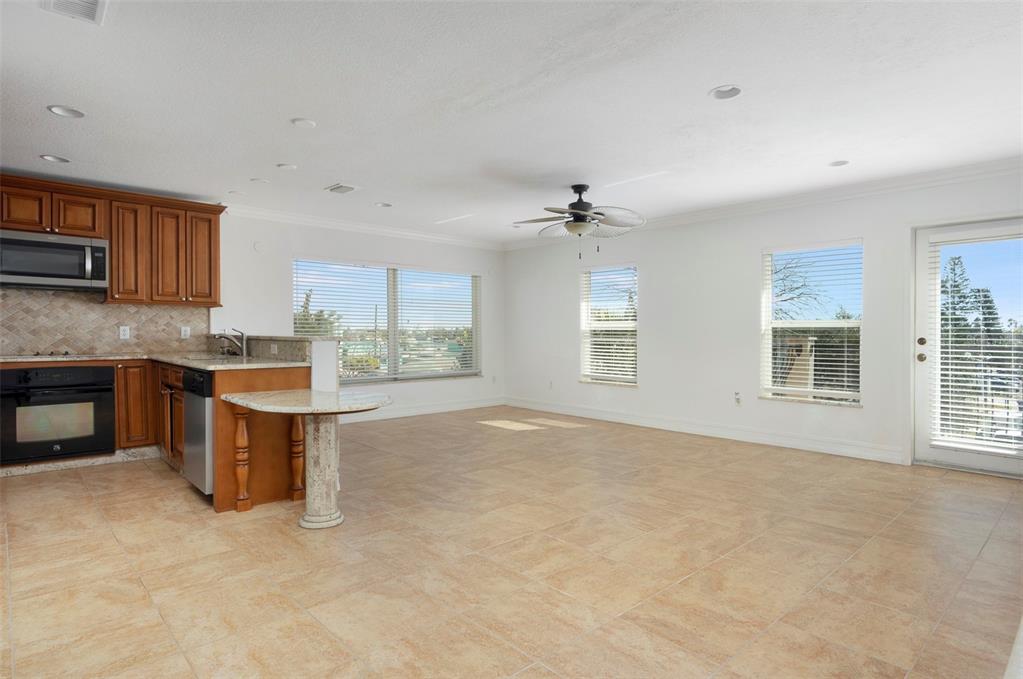 114 143rd Avenue, Unit B Madeira Beach, FL 33708 - Photo 3 of 14 a view of kitchen with kitchen island and windows