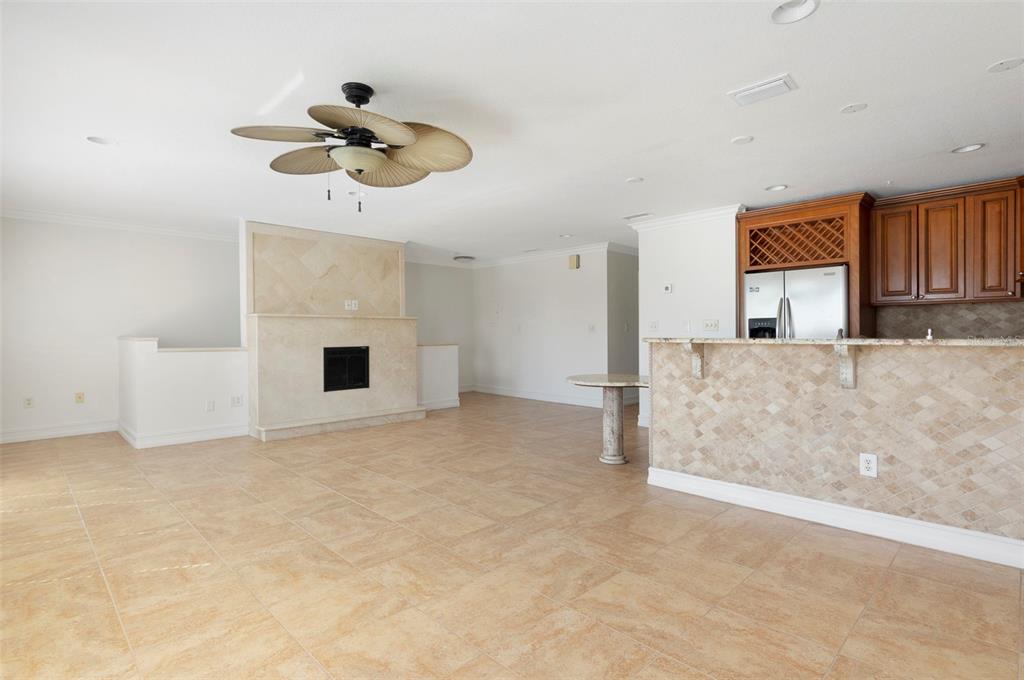 114 143rd Avenue, Unit B Madeira Beach, FL 33708 - Photo 5 of 14 a view of a livingroom with a chandelier fan and windows