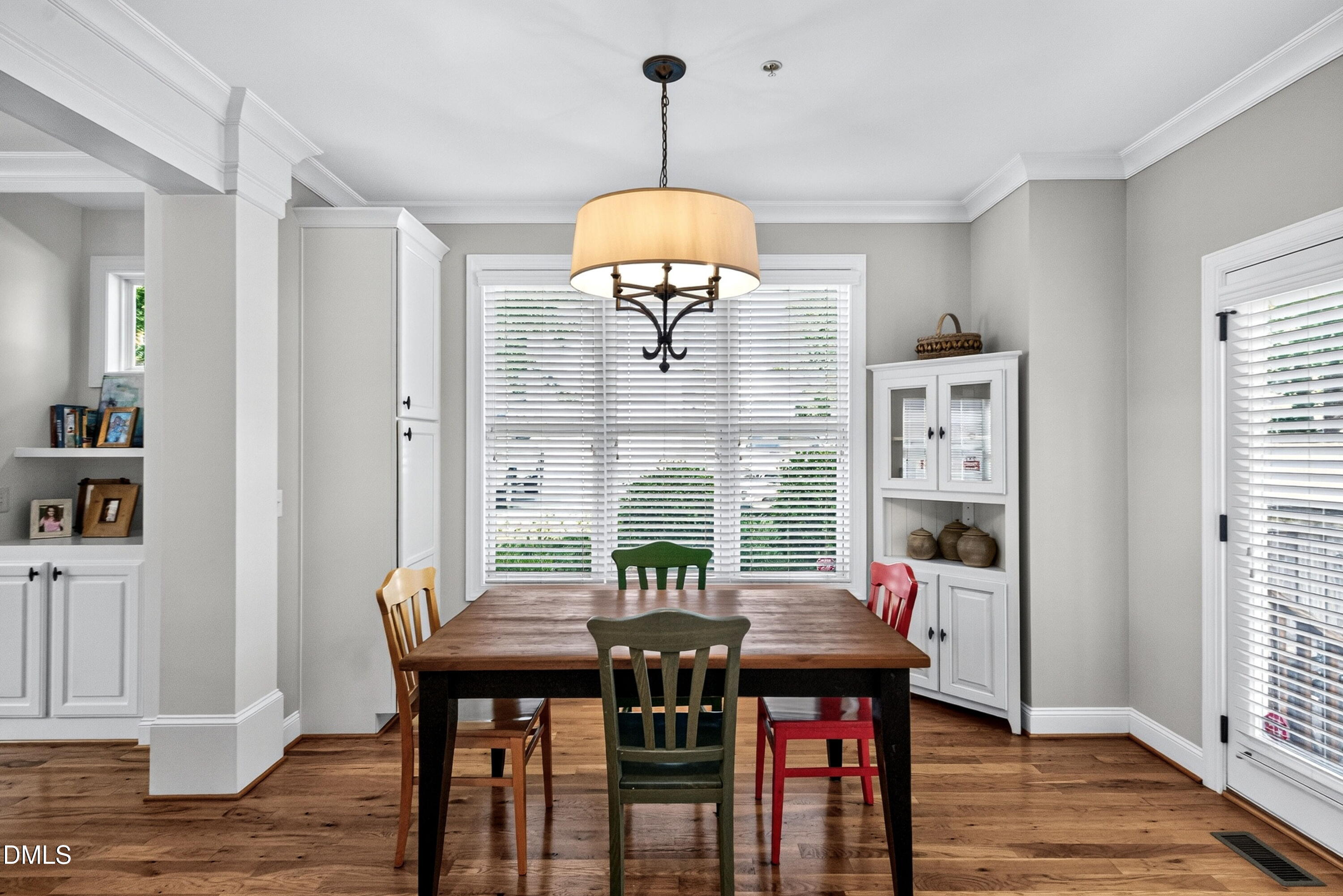 2745 Oberlin Road, Unit 103 Raleigh, NC 27608 - Photo 14 of 23 a view of a dining room with furniture and wooden floor