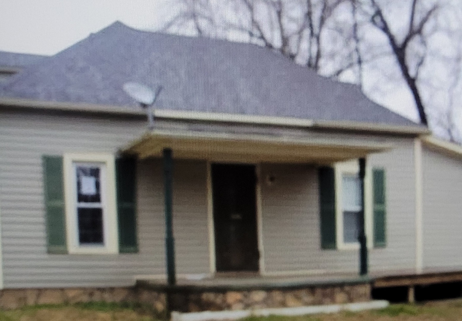 30 Grimes Road Harrisburg, IL 62946 - Photo 1 of 1 a front view of a house with garage